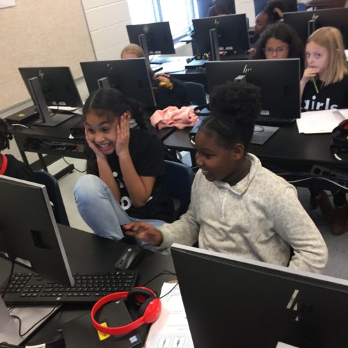 Children learning coding in after-school program